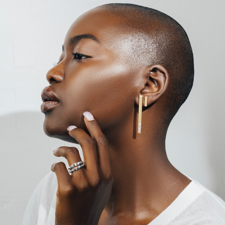Woman wearing Tracee Nichols Gold Stix earrings